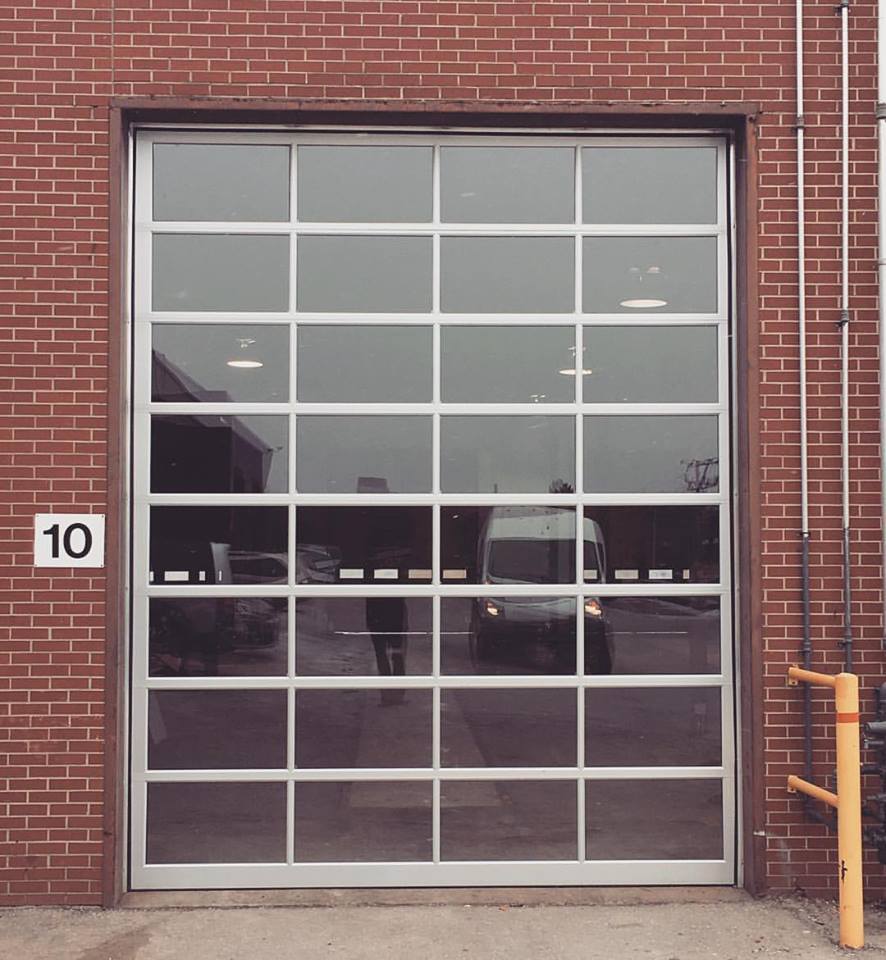 Full view commercial aluminum door with clear windows, B.J. Electric
