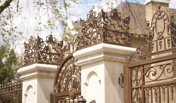 A collection of ornate custom metal gates and handcrafted metalwork.