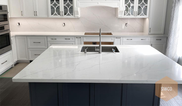 Quara Stone Quartz Kitchen Countertop and Backsplash. Popular white quartz kitchen countertop. Quartz Color: Statuaria Octavia